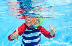 Instructor teaching swim lessons in the pool